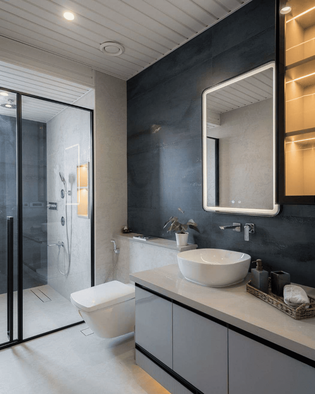 Bathroom with charcoal stone feature wall and walk-in shower
